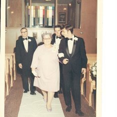 Dad walking great grandma Carocci down the isle during a wedding. He was probably 18-19.