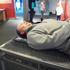 Joe on the bed of nails at the MD science museum