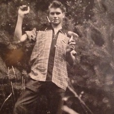 Dad, at around 17 years of age, in the forest looking for mushrooms. And he found a keeper.