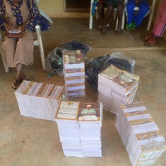 Photos showing the distribution of school bags n books from John Afolabi Bello Foundation