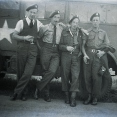 John and brother Francis to right with soldiers in front of army truck 1945