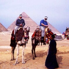 John at the Pyramids riding a camel.
