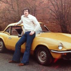 John by his car in 1978. One stylish dude.