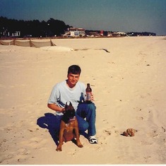 John down on the beach with his dog Lennex...