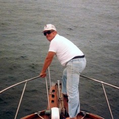 John on the bow of the Lucky Day