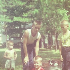 Big brother Jack with Wade, Vic, our puppy Dixie, and Vic's buddy Steven Brady. Jackson, Mississippi 1959