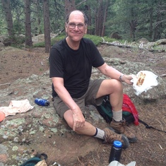 Dad cheerfully enjoying lunch on one of our many hikes  