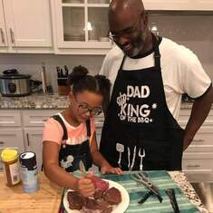 Glenn's youngest daughter teaching HIM how to cook.