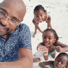 John had taken his nieces on a beach walk in Watamu. X