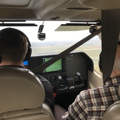 Kirk and John in the front seat of Cessna 206 flying to Harris Ranch for breakfast.