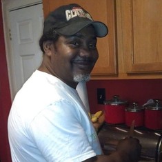 My husband in the kitchen.