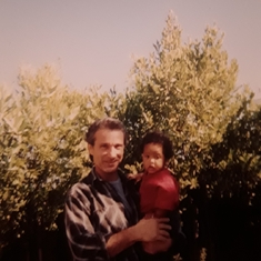John with baby Jahfari in our garden at the big house in Petaluma