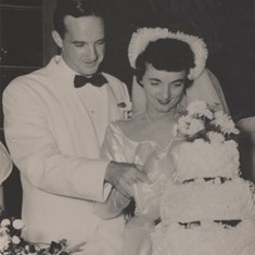 Mom and Dad cut wedding cake-cropped