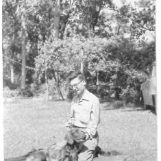 Dad and one of their Irish Setters, probably George, probably in Fort Knox