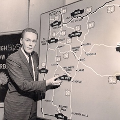 Weatherman John gets used to the upgrade: from chalkboard to feltboard for his weather segment on the KPTV news, early 1960's Portland