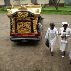 Mama leaving the hearse outside church