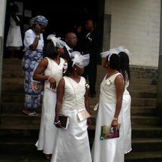 Girls waiting for the casket outside church