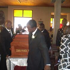 Casket being brought into church