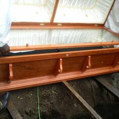 Preparing the casket for burial