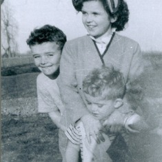 John with his little brother Leo and sister Barb on the farm growing up
