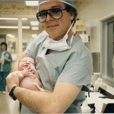 John holding baby Britt after she was born