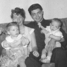 Mom Dad holding Roxanne & Johnny
