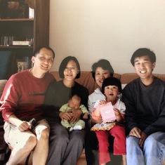 Baby Tori and little Iris with proud new parents and friends (2002)