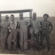 Dad on the right, always with the widest smile, many times with his hands on his hips.