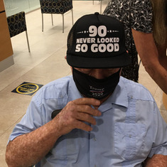 The bank gifted him a hat saying 90 years old, he was excited!