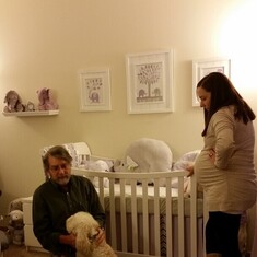 John was always there for his children, including nursery set-up (and dog-cuddles)