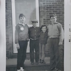 Siblings Gerry, John, Mark and George, in October 1958 when John was just seven. The hat, he always said, was one of his very favorites.