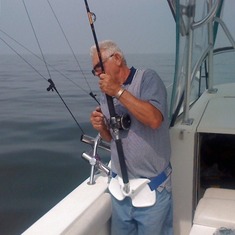 Dad fishing on Hal's boat