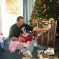 Opening presents with Bella on her first Christmas