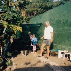 The enormous vervet monkey-proof veggie garden he built. We're helping!