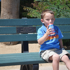 Cameron sitting on PaPa's memory bench. 2-2011
