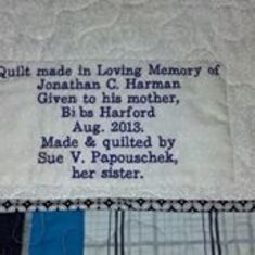 Banner on back of quilt.