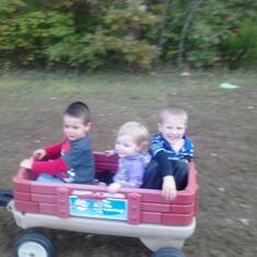 Anthony, Sophia, & Tristian Riding in the wagon