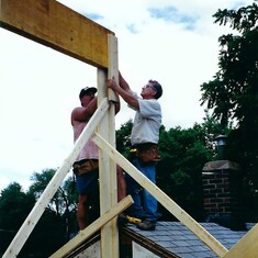Jonathon and my dad setting the beam on the house addition in 2000.