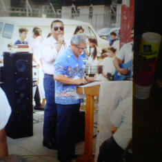My father doing what he loved best.. sharing the Word of God.