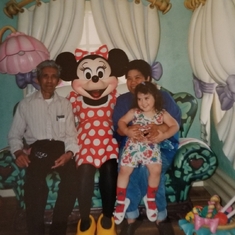 At Disneyland meeting Minnie Mouse in 1993. Pictured with her father and youngest daughter.