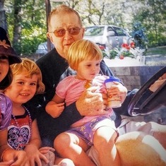 Grandpa having a fun golf cart ride with the Walton girls.