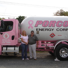 Debbie and Joe in front of the pink ”breast cancer awareness” truck.