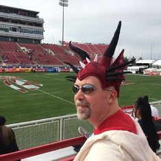 In his Wales dragon hat at the USA rugby sevens games. 