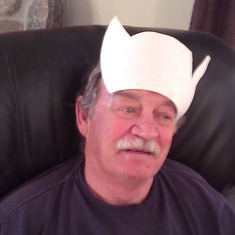 The girls made Grampy a crown and tapped it directly to his face.