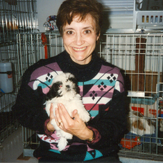 January 1996 Joyce holding our first dog, Cookie Lopez. She lived for 17 years