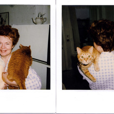 Judy holding both Stephanie (baby) and the family cat, Beast 