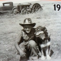 Jule with his dog "Lucky" on his family's ranch on the Prairie near Tama, South Dakota