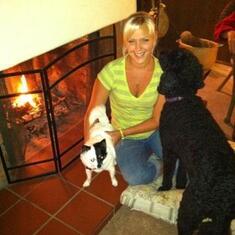 Our granddaughter Heather with our family pets, relaxing by the fire in our living room in Southern California