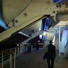 Jule strolls on the upper deck of The Queen Mary in Long Beach, California on a drizzly evening.