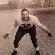 Jule's High School football photo. You won't get past him with that strong grip!